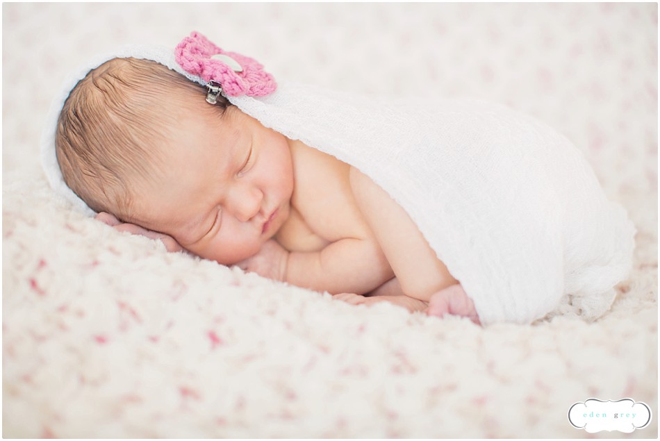 A swaddled newborn during her Houston Newborn Portraits