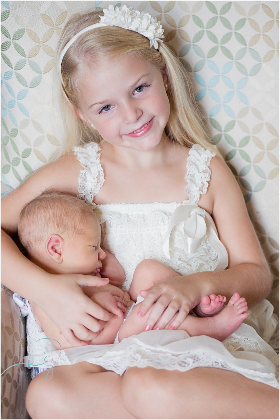 Sister holding her newborn baby brother, Texas newborn photographer